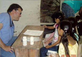 Dr. Carlos Delgado visits wtih young patients