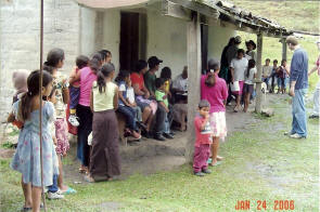 Patients wait in line to see a doctor